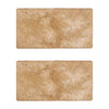 Two rectangular Walnut Travertine 3X6 Tumbled tiles showcasing a natural finish