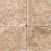 Four Walnut Travertine 6X6 Tumbled tiles showcasing natural elegance and texture