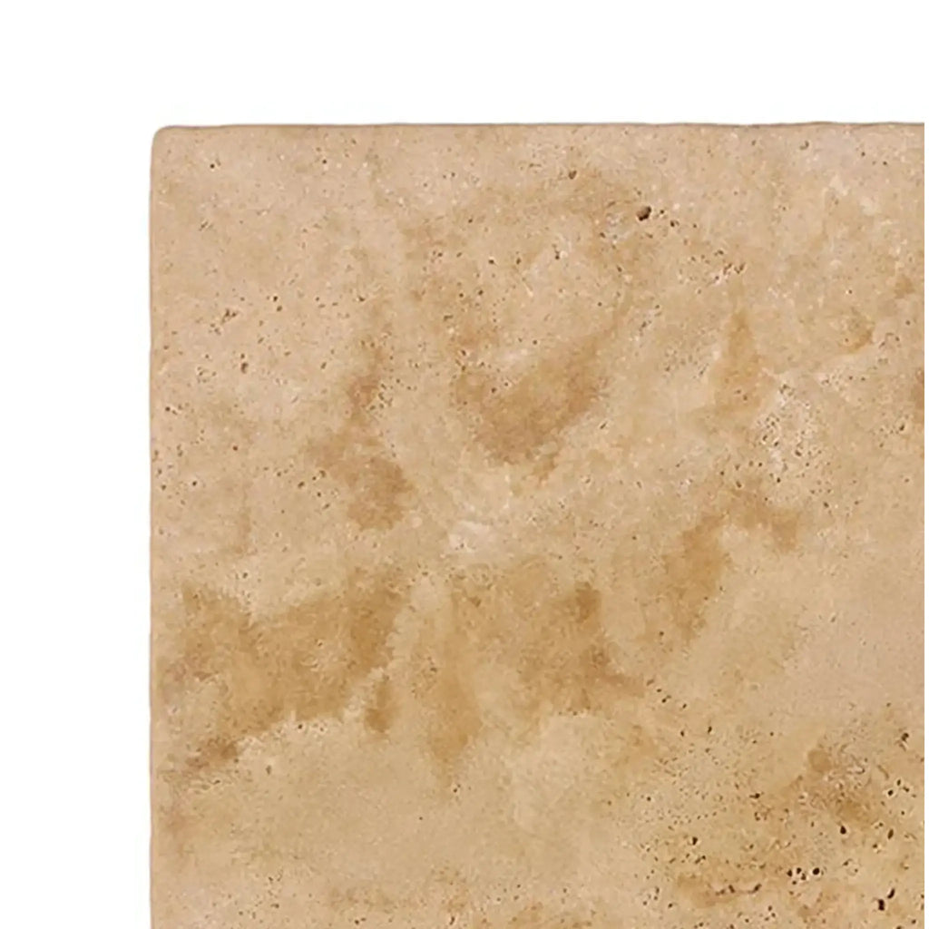 Walnut Travertine 6X6 Tumbled tile showcasing a porous texture for elegant surfaces