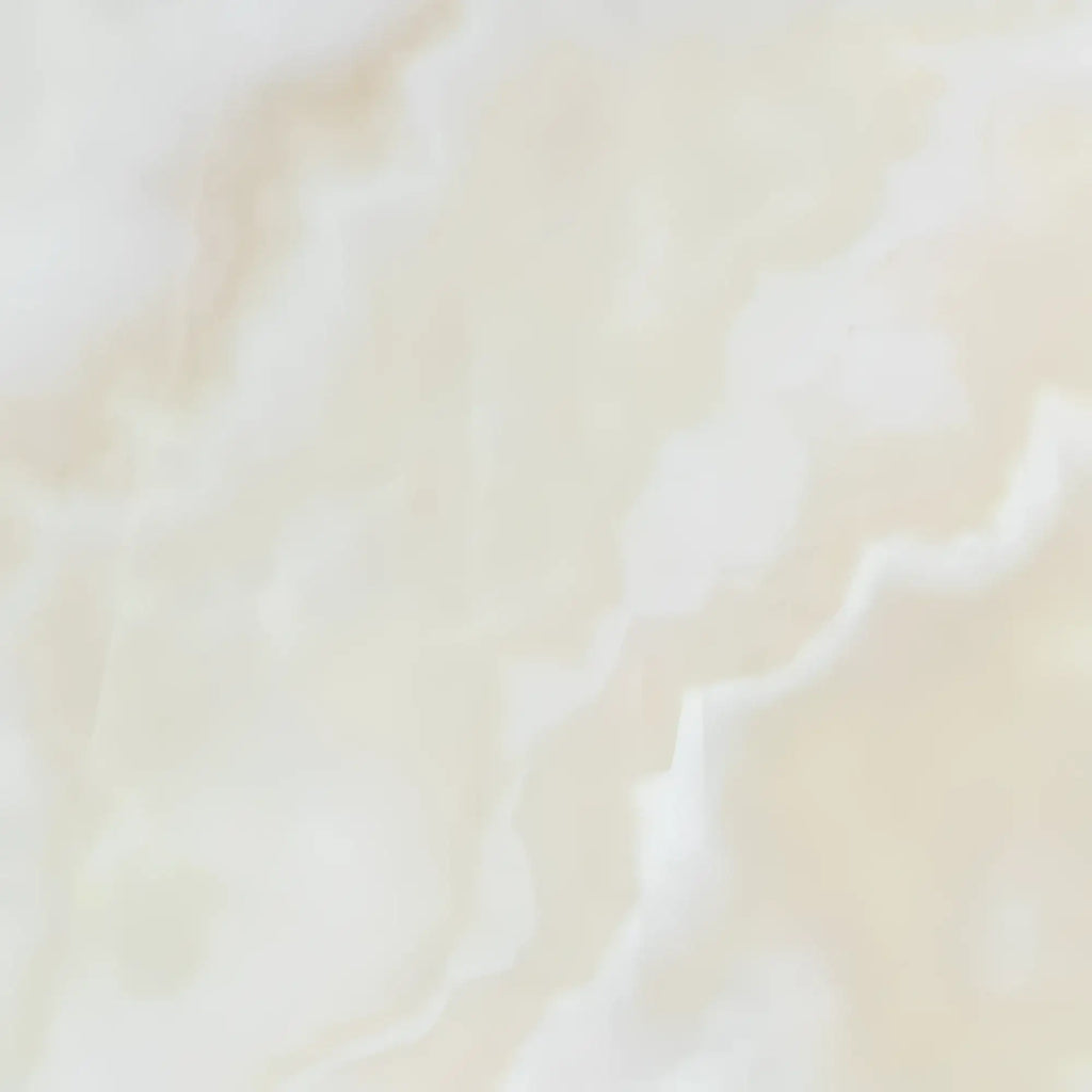 Creamy marble texture of White Onyx Bianco-Vanilla Cross-Cut 12X12 Polished slab
