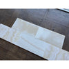 White Onyx Vanilla Onyx cross-cut 12x24 polished marble tiles staggered on wood floor