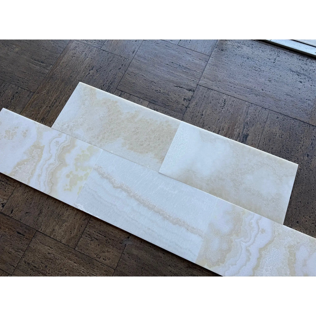 White Onyx Vanilla Onyx cross-cut 12x24 polished marble tiles staggered on wood floor
