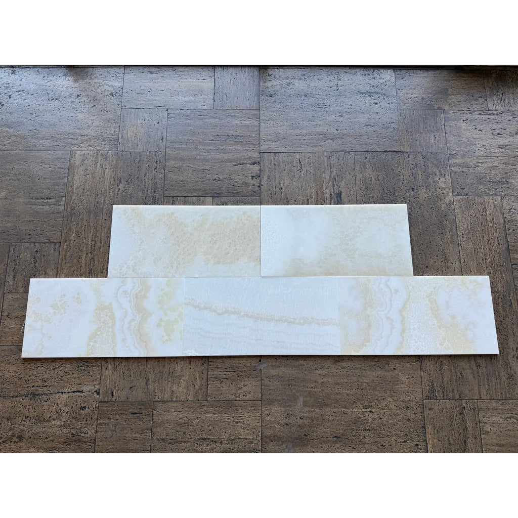 White Onyx Vanilla Onyx cross-cut 12x24 polished marble tiles on wood floor