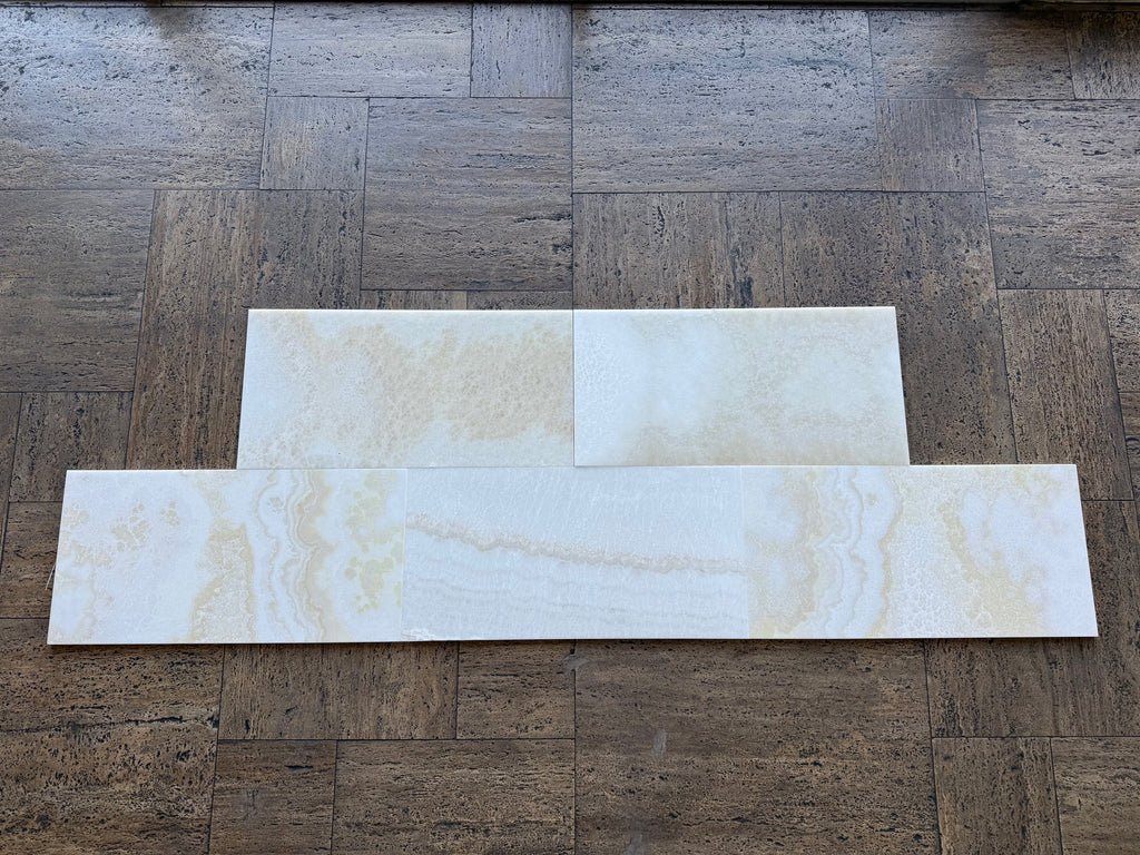 White Onyx Vanilla Onyx cross-cut 12x24 polished marble tiles on wood floor