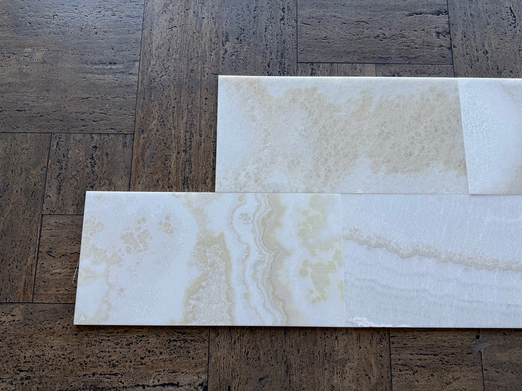 White Onyx Vanilla Onyx cross-cut 12x24 marble tile on dark wood floor