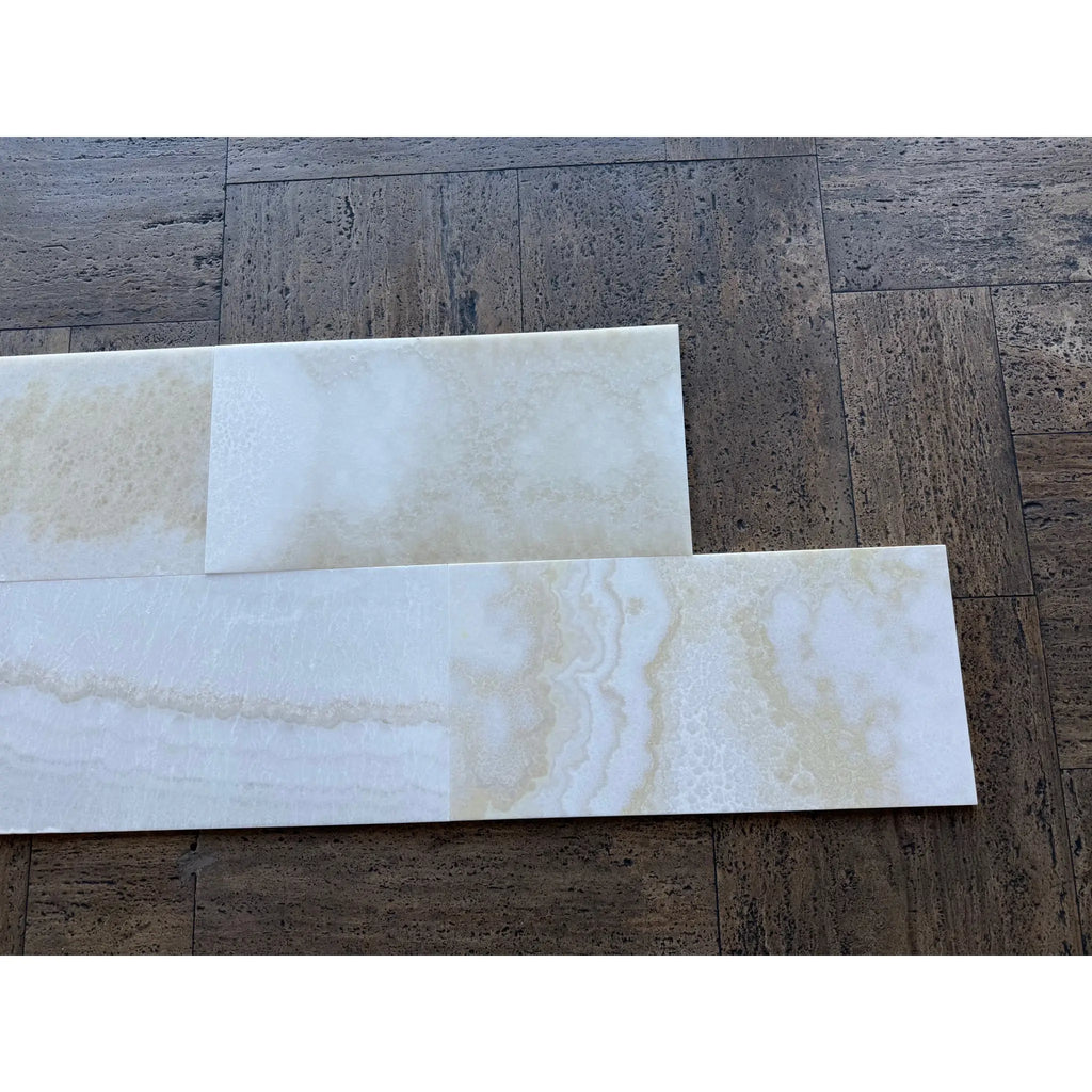 White Onyx Vanilla Onyx 12x24 polished tiles on dark wood floor