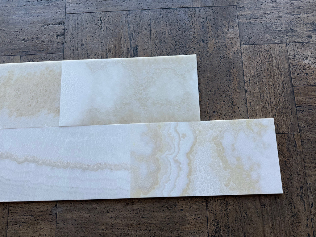 White Onyx Vanilla Onyx 12x24 polished tiles on dark wood floor