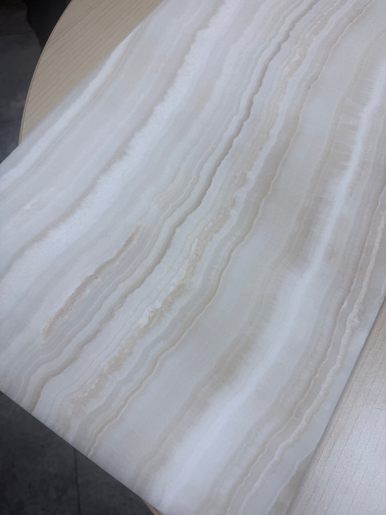 Cream and beige striped textured wallpaper with a wavy pattern for White Onyx Marble decor