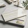 Creamy beige turkish white onyx marble tile with soft wavy veining polished finish 12x24 vein cut