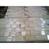 Beige and cream-colored white onyx vein-cut 2x4 mosaic marble polished tiles arranged in a staggered brick-like pattern