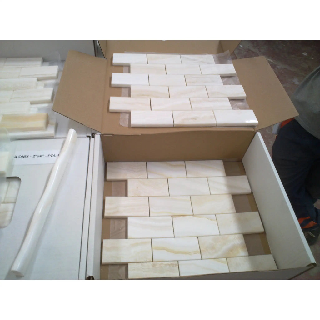 White onyx vein-cut 2x4 mosaic marble polished tiles in white marble effect with subtle veining arranged in stacked brick pattern