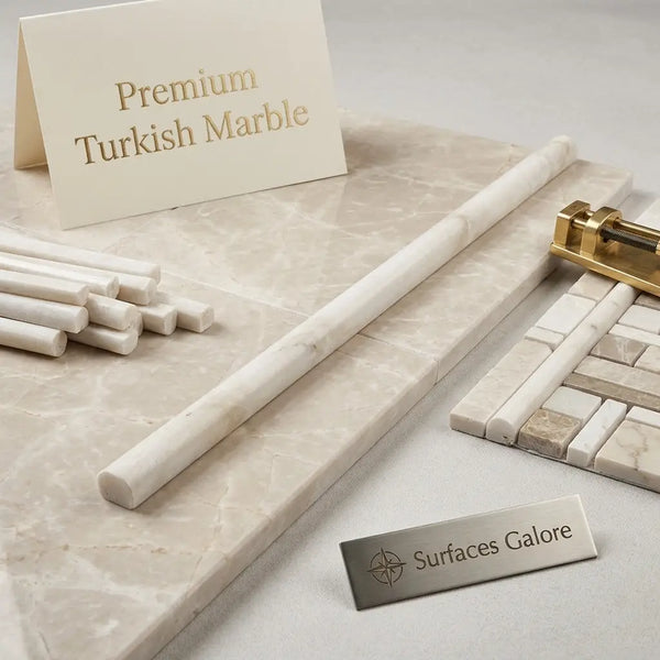 Cream-colored Turkish marble countertop with subtle veining and polished finish in white pearl Botticino pencil liner molding