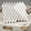 White diamond-shaped mosaic tiles made of authentic turkish white pearl and botticino beige marble arranged diagonally
