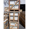 Stacked wooden crates holding white pearl botticino beige marble 12x12 polished or honed panels secured with green straps