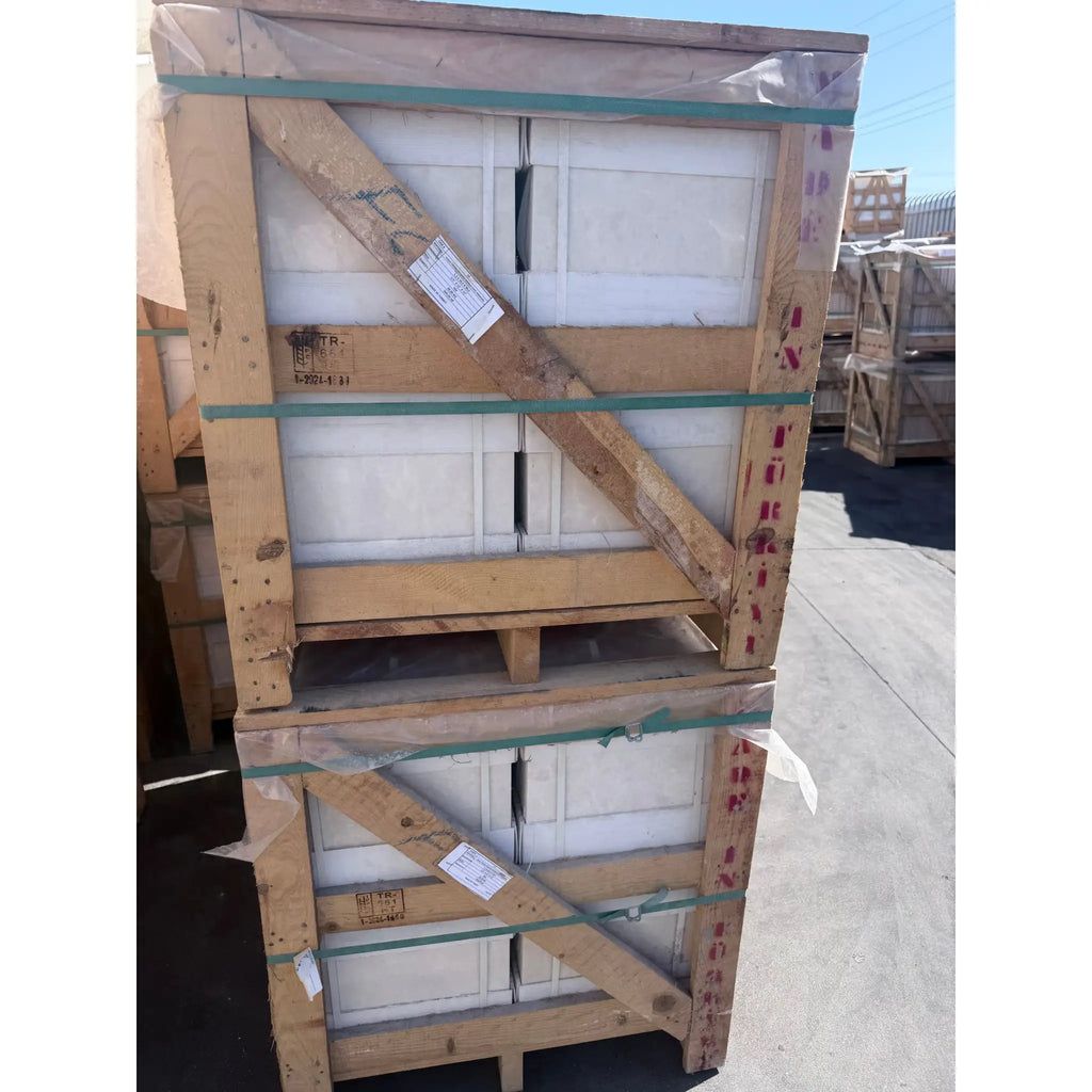 Stacked white pearl and botticino beige marble 12x12 polished or honed tiles secured in wooden crates with green straps