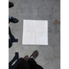 Four off-white white pearl botticino beige marble 12x12 tumbled ceramic tiles with subtle marbled texture in 2x2 grid
