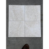 Four square light gray white pearl botticino beige marble 12x12 tumbled tiles arranged in a grid