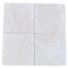 Four square light gray white pearl botticino beige marble tiles with subtle veining arranged in a 12x12 grid