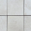 Light-colored square tiles of White Pearl/Botticino Beige Marble 12X12 Tumbled