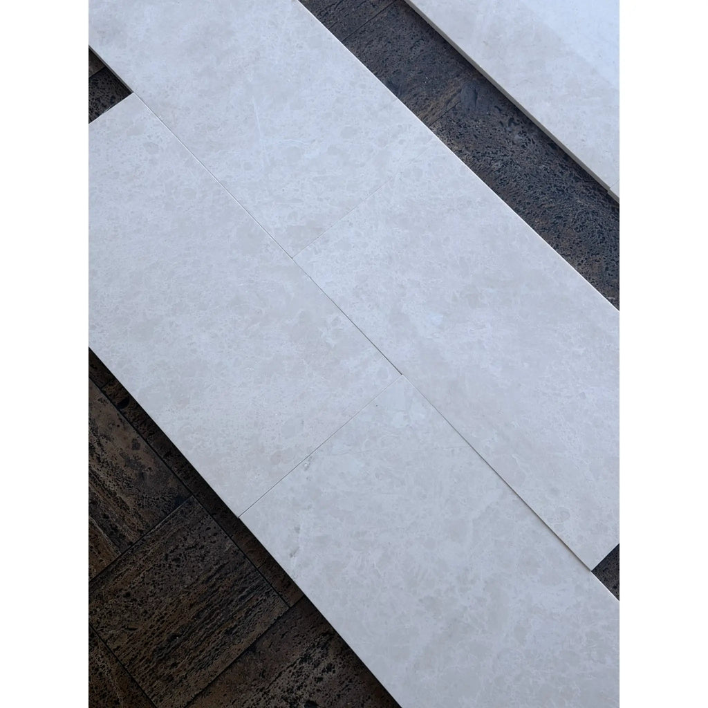 White Pearl Botticino Beige Marble 12x24 light gray marbled tiles on dark wood