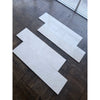 White Pearl Botticino Beige marble 12x24 polished tiles with subtle veining on dark floor