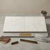 Cream-colored turkish marble tiles with subtle veining on a stone slab white pearl botticino beige marble 18x18 polished or honed