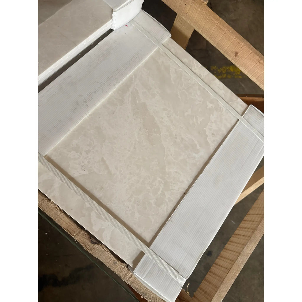 Packaged square tile with light marbled pattern from White Pearl Botticino Beige Marble collection