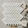 White pearl botticino beige marble tiles polished in a 1x3 herringbone mosaic pattern showcasing turkish marble