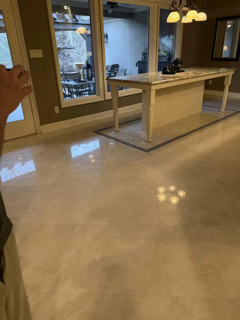 Cream-colored White Pearl Botticino Beige marble kitchen island with light beige countertop and white legs