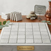 White pearl botticino beige marble 4x4 tumbled tile tray with grid pattern and gold surfaces galore plaque at front