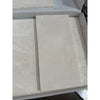 Beige marble-effect rectangular tiles with subtle veining and a smooth glossy finish in white pearl botticino beige marble 6x12 polished or honed