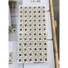 Cream and dark gray marble pinwheel mosaic with Emperador Dark dots, polished